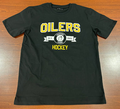 Black T-Shirt with OILERS HOCKEY printed on the chest. Between those two words is a small banner with the Oilers' Rigger head logo and text reading "OKOTOKS OILERS EST. 2005".