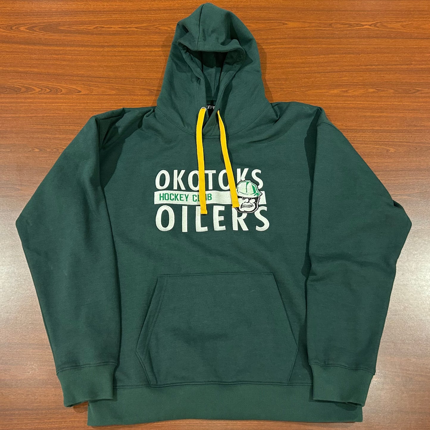 Green hoodie with OKOTOKS OILERS HOCKEY CLUB and the Okotoks Oilers' Rigger head logo embroidered on the chest. The hoodie also has a yellow drawstring.